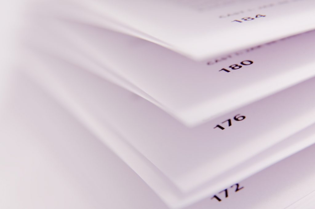 Picture of stack of paper with page numbers in bottom corner