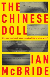 Book cover for The Chinese Doll. Cover is Yellow with the title and red. The face of an Asian woman is partially obscured.