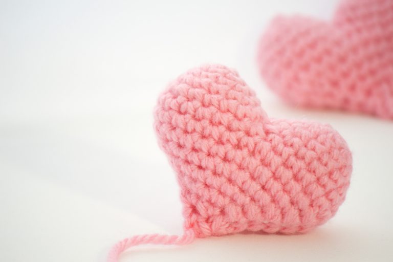 Picture of two pink crochet hearts.